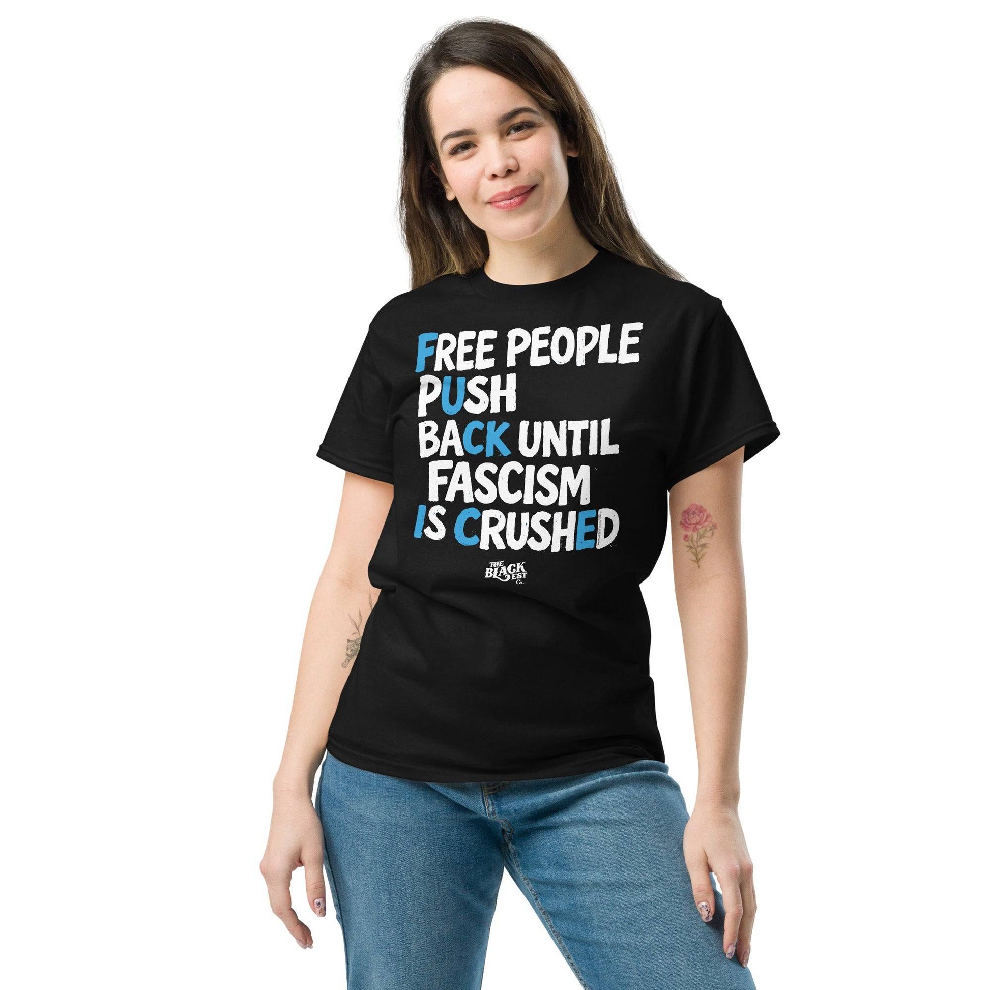 Black protest t-shirt with white and blue text supporting immigration justice