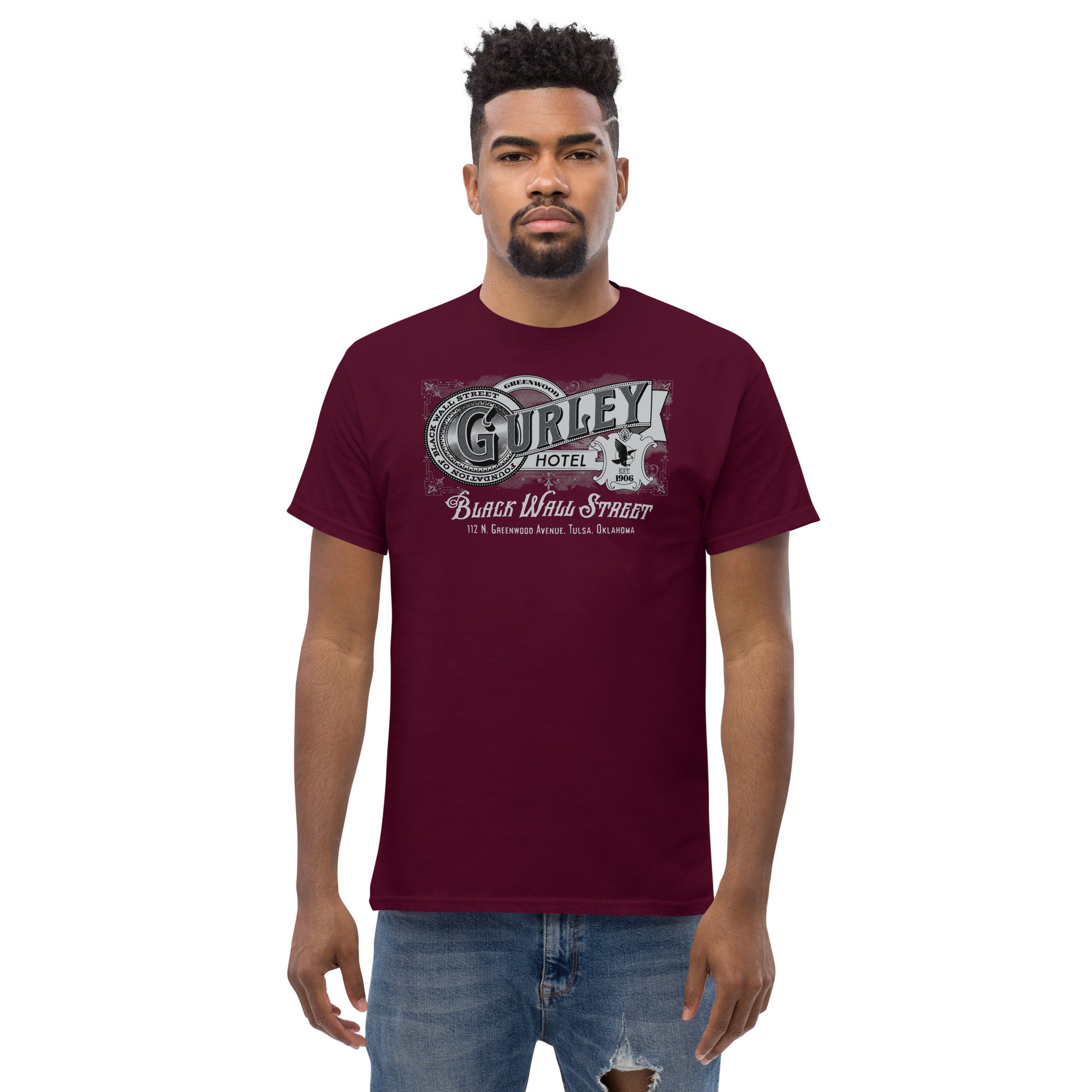 Model wearing burgundy Gurley Hotel graphic T-shirt with Black Wall Street design