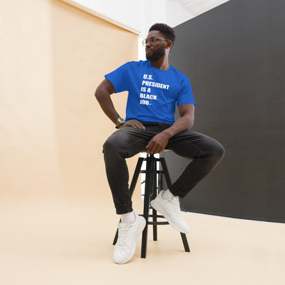 Man seated wearing blue 'U.S. President Is A Black Job' t-shirt