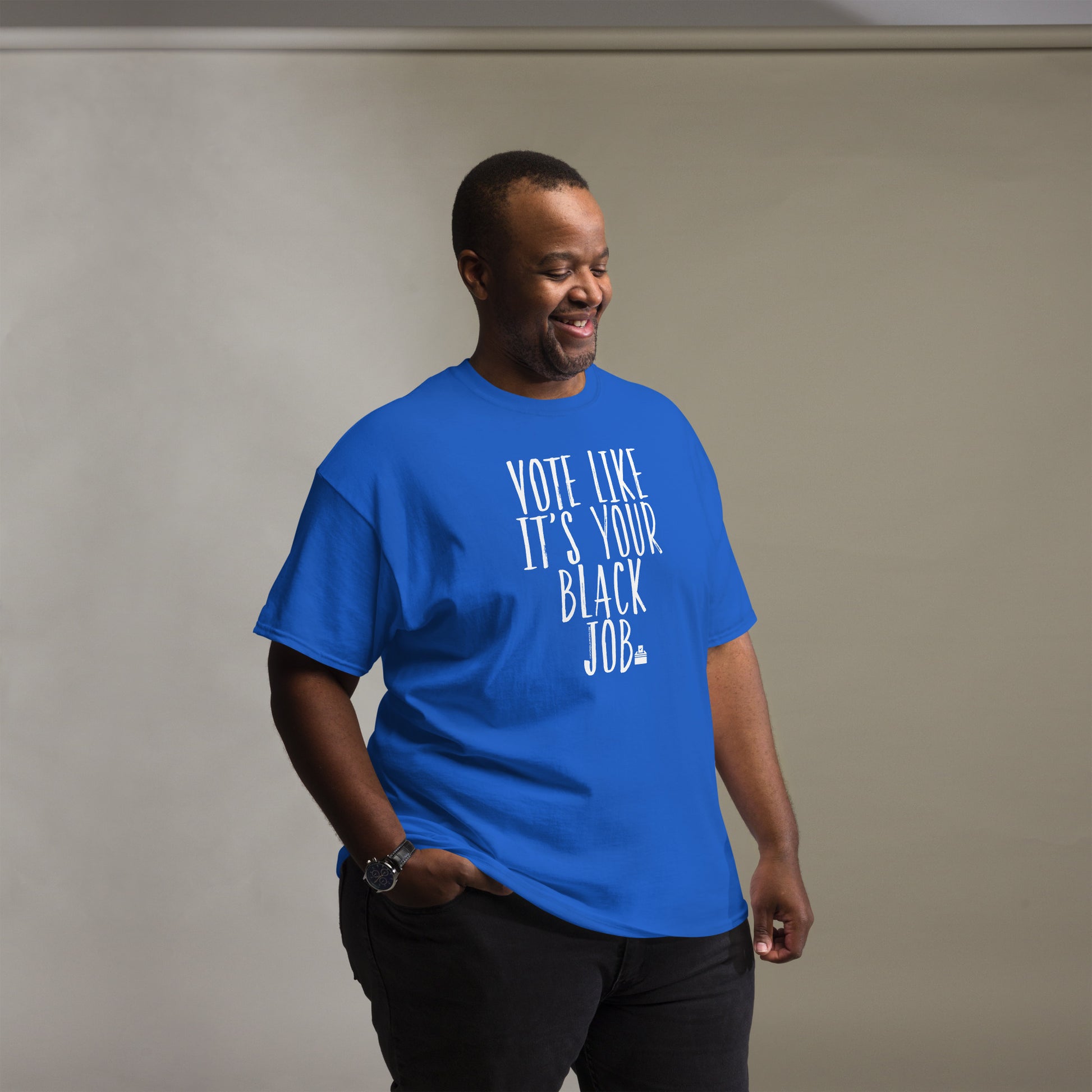 a man in a blue t - shirt that says vote like it's your black job is smiling