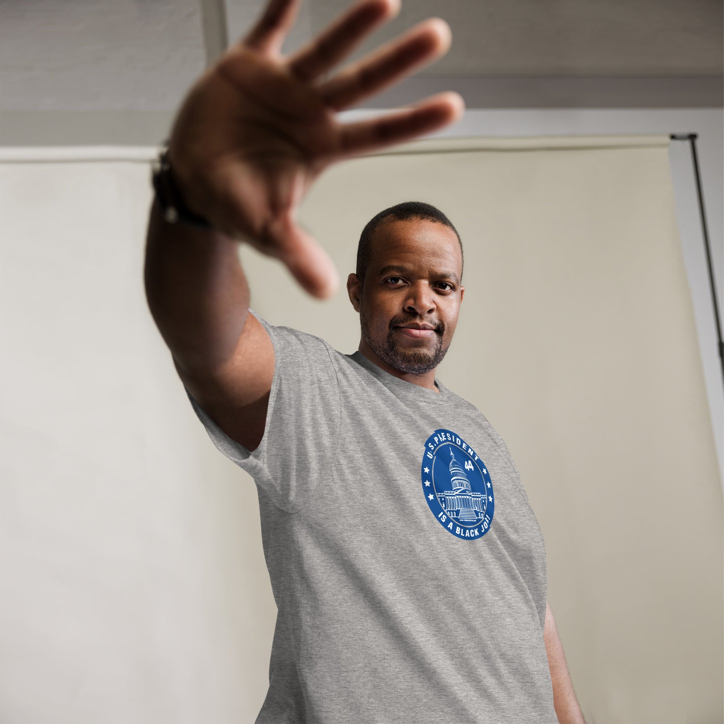 Man wearing gray 'U.S. President is a Black Job' t-shirt