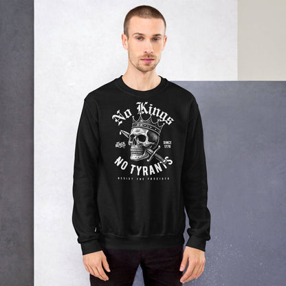 Male model in black No Kings No Tyrants Skull Protest Sweatshirt, featuring bold anti-fascist message and skull graphic by TheBlackest Co.