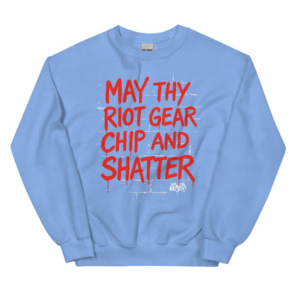 Light blue May Thy Riot Gear Chip And Shatter Unisex Sweatshirt with red activist text, ideal for winter wear and cultural pride.
