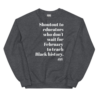 Gray sweatshirt with white text 'Shoutout to educators who don't wait for Black history,' made of comfortable cotton fabric for teachers.
