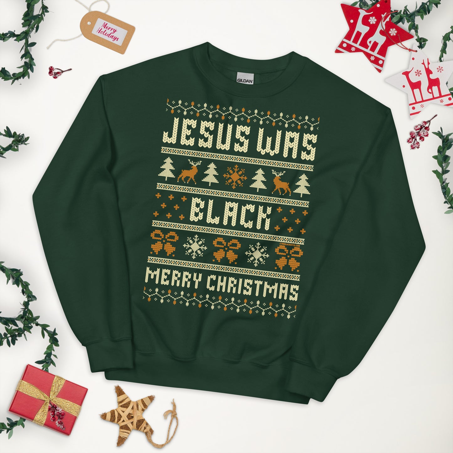 Green Jesus Was Black Merry Christmas Unisex Sweatshirt by TheBlackest Co. styled flat lay with festive holiday decor, ideal for gifting.