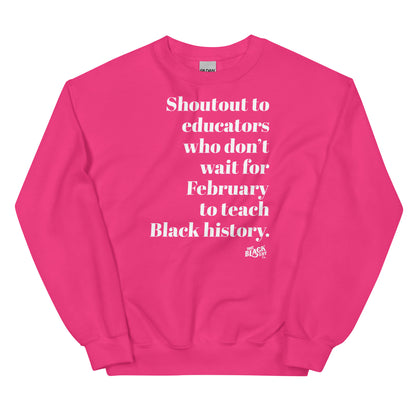 Pink sweatshirt featuring the same white text message supporting educators in teaching Black history year-round, comfortable style