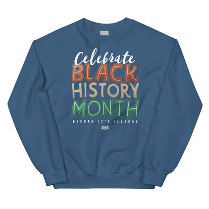 Blue sweatshirt with 'Celebrate Black History Month Before It’s Illegal' text in bold multicolored lettering. Comfortable and stylish for casual wear.