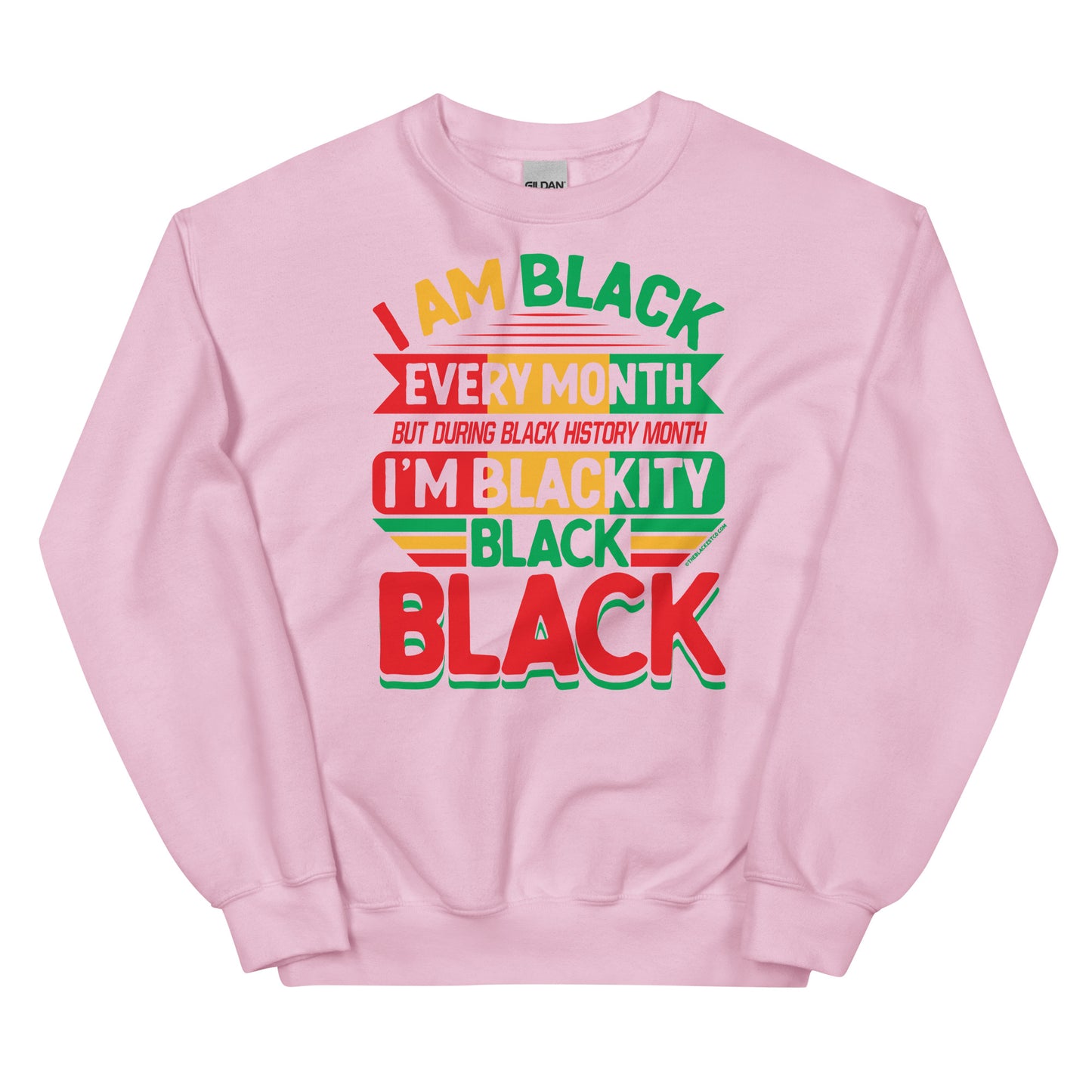 Blackity Black Black History Month Sweatshirt by TheBlackest Co in light pink with bold red, green, and yellow text design celebrating Black pride.