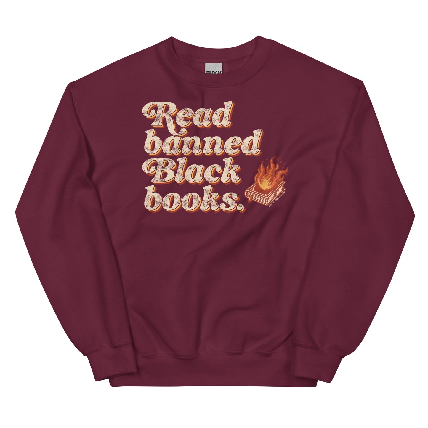 Maroon unisex sweatshirt with 'Read Banned Black Books' text and a flaming book graphic, perfect for cultural expression and cozy wear.