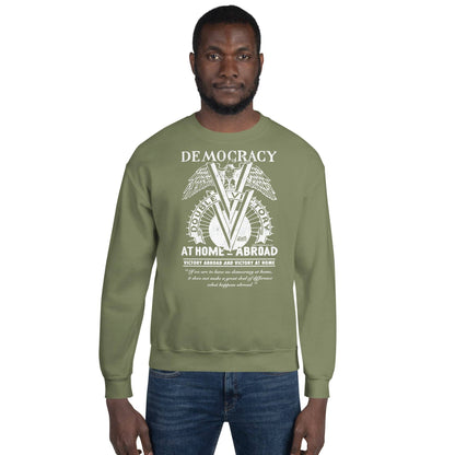 Man wearing olive green Double V Campaign WWII Black Soldiers Sweatshirt featuring vintage-style graphic celebrating Black military history.