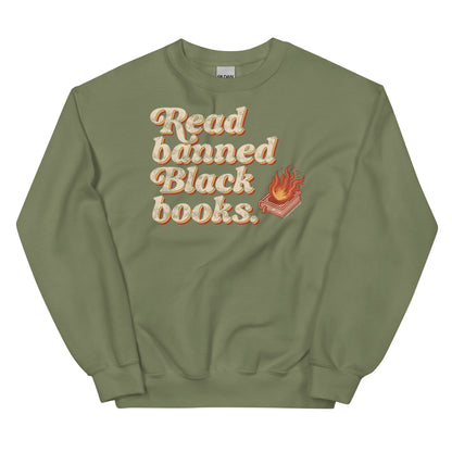 Olive green unisex sweatshirt featuring 'Read Banned Black Books' text and a flaming book graphic, perfect for cultural pride and everyday comfort.