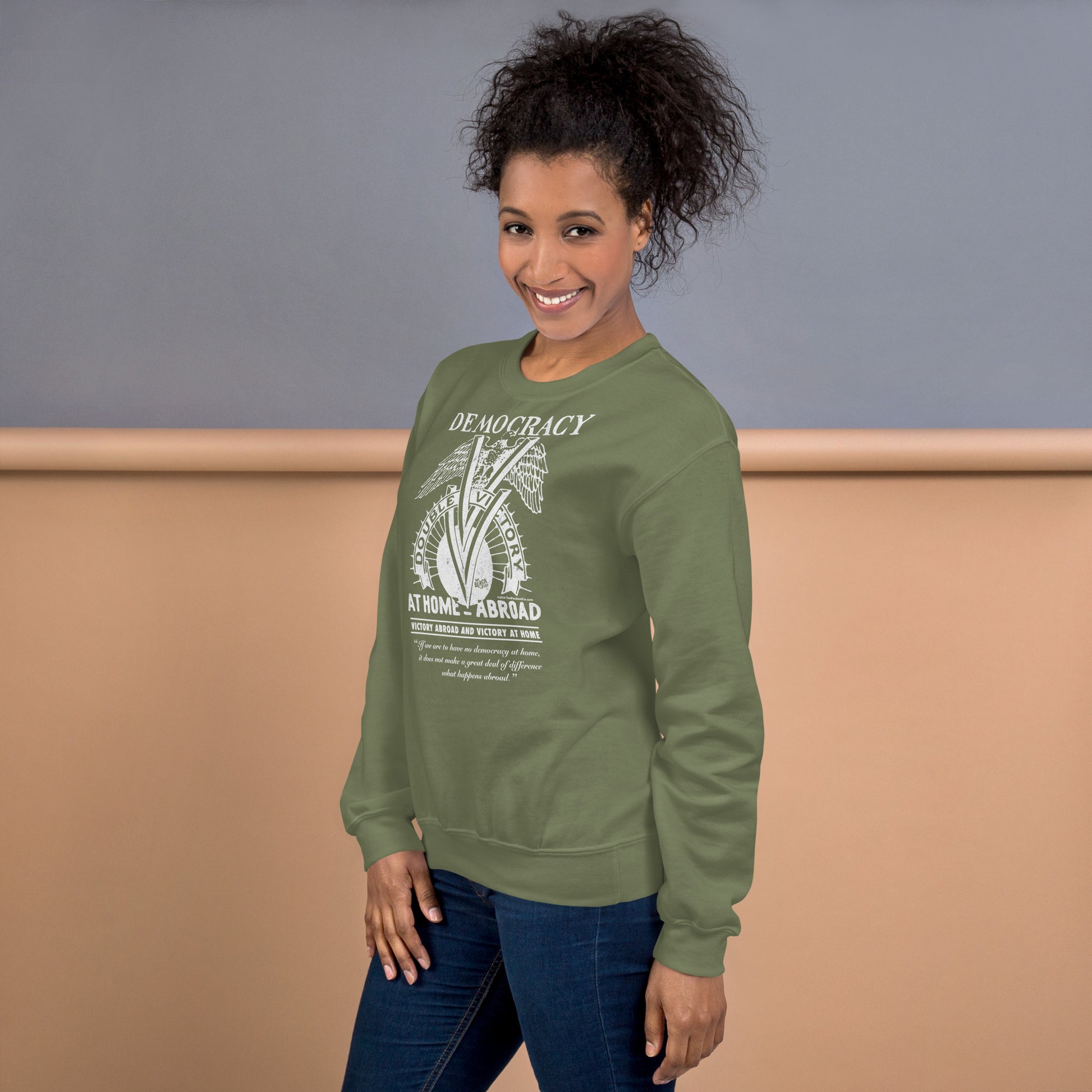 Woman modeling olive green Double V Campaign WWII Black Soldiers Sweatshirt, a soft fleece pullover honoring WWII Black soldiers' legacy.