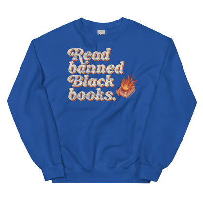 Royal blue unisex sweatshirt featuring 'Read Banned Black Books' text and a flaming book graphic, ideal for cultural advocacy and casual wear.