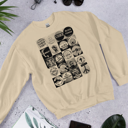 Flat lay of beige Civil Rights Button Sweatshirt with retro civil rights graphics. Ideal cozy gear for history lovers and cold weather fashion.