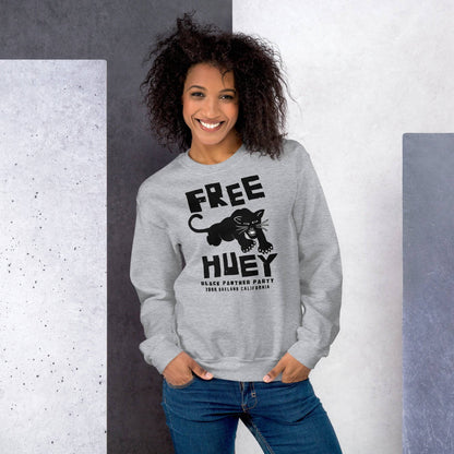a woman wearing a grey sweatshirt with a black panther on it and says free huey