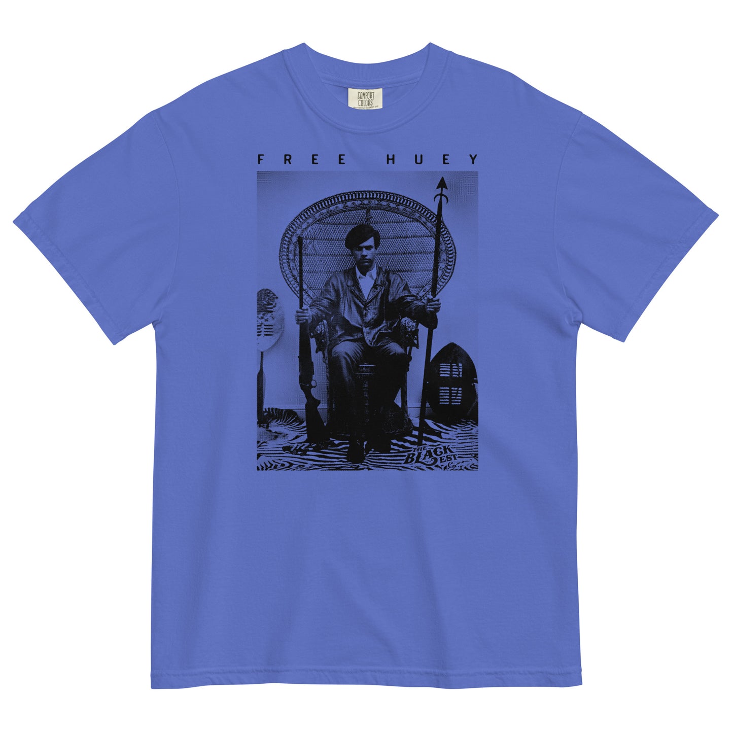 an ice blue t shirt with a picture of huey p newton sitting on a wicker chair