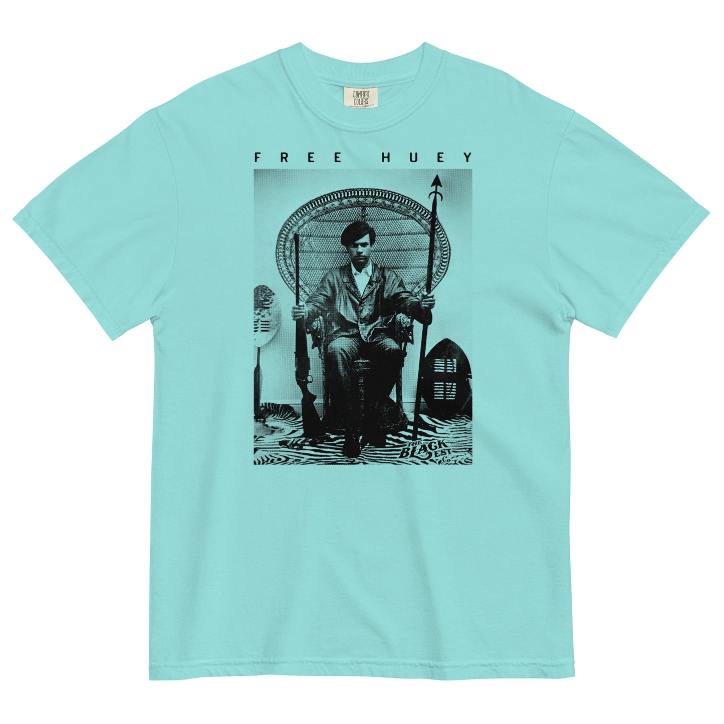 a aqua t shirt with a picture of huey p newton sitting on a wicker chair
