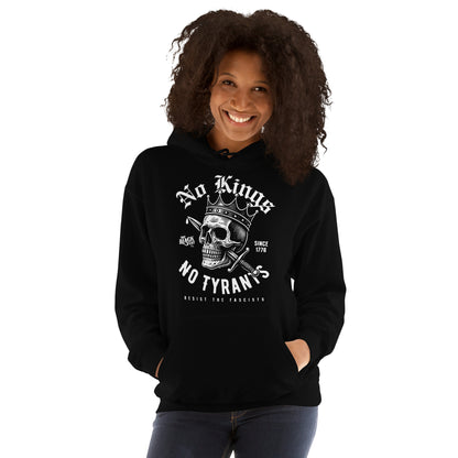 Woman posing confidently in No Kings No Tyrants Skull Protest Hoodie by TheBlackest Co., a unisex pullover with bold skull and anti-fascist print.