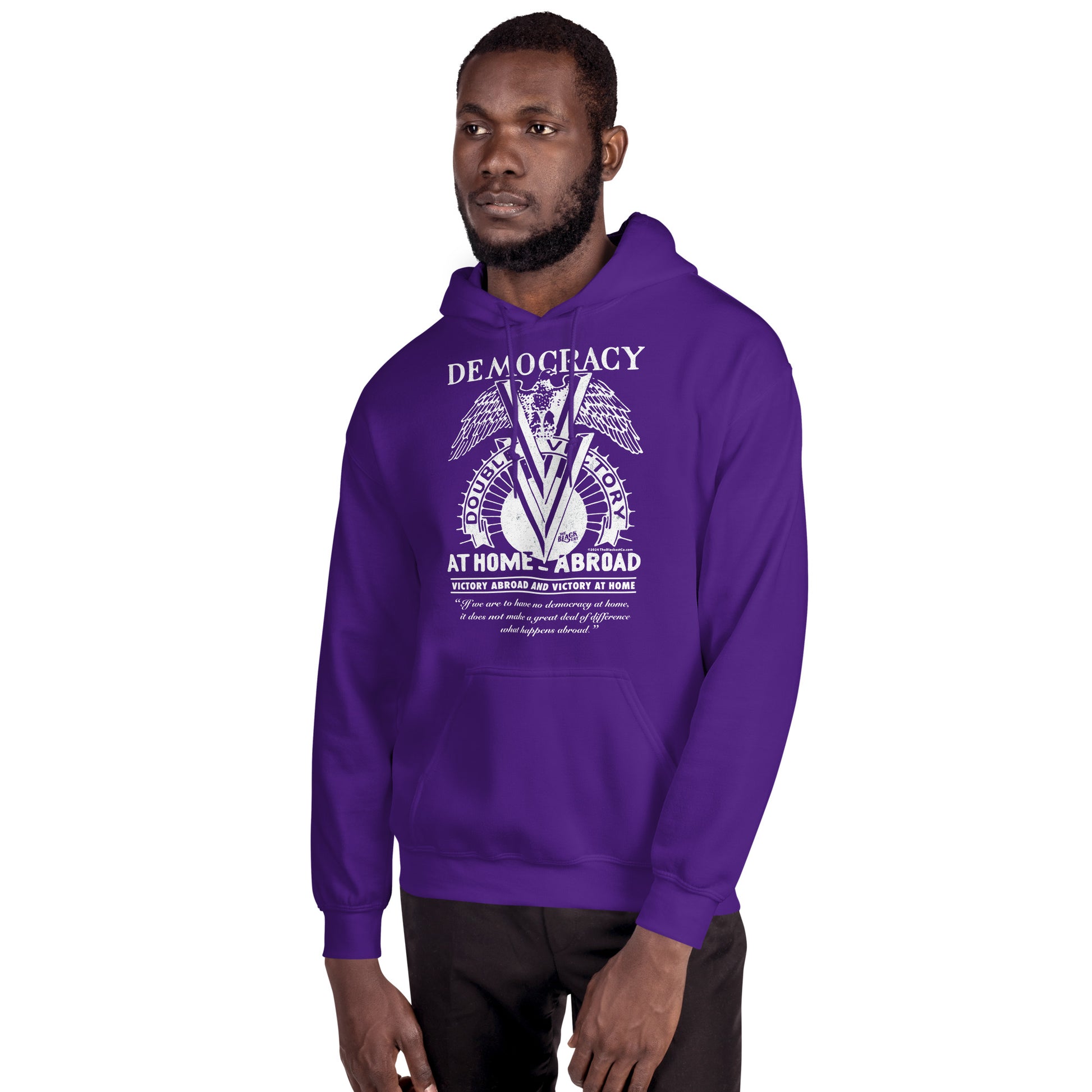 Man modeling purple Double V Campaign WWII Black Soldiers Hoodie with front graphic honoring Black veterans' WWII contributions.