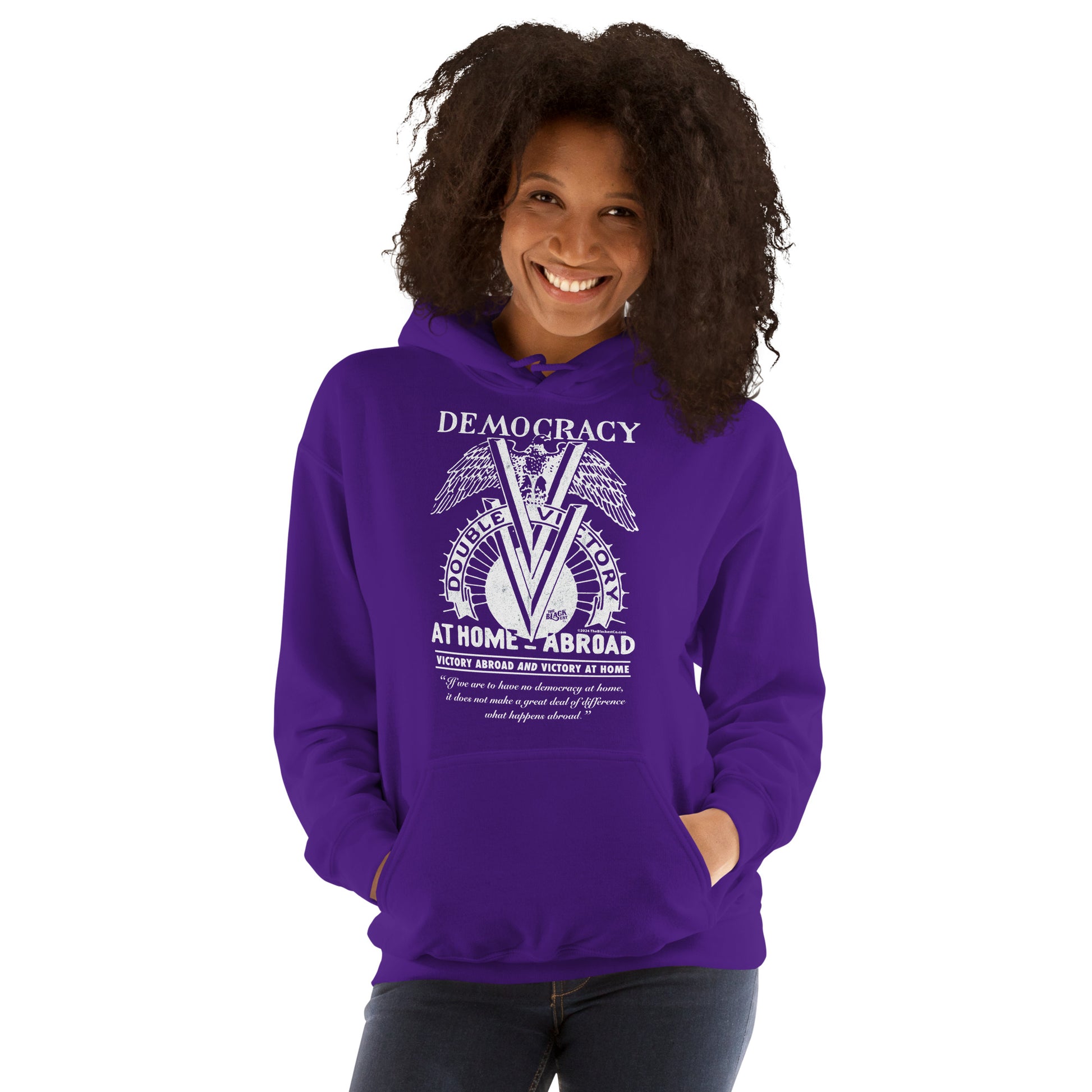 Smiling woman in purple Double V Campaign WWII Black Soldiers Hoodie with front pocket and historic WWII Black soldiers design.