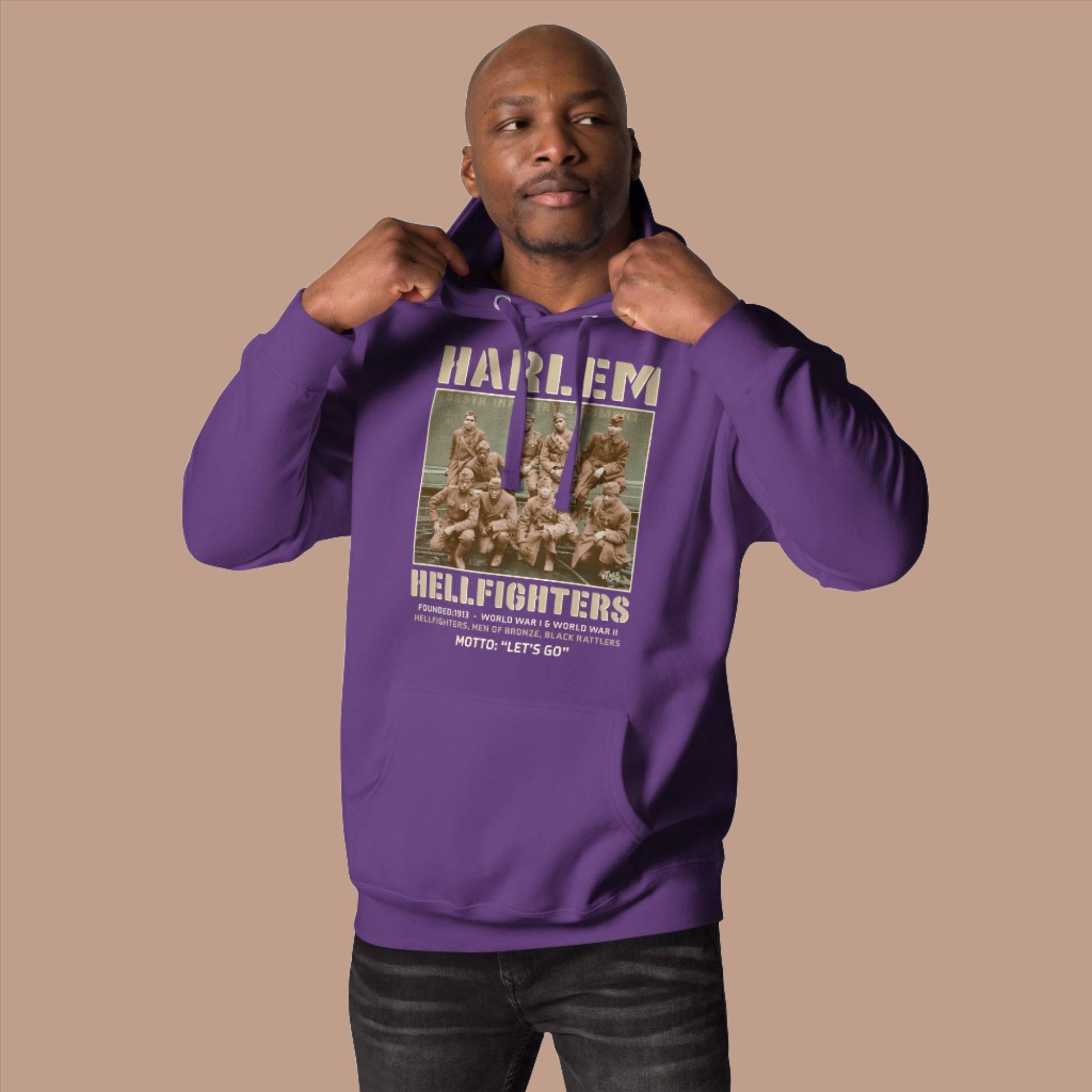 black man wearing purple pullover hoodie with vintage image of the wwi soldiers and text that reads harlem hellfighters