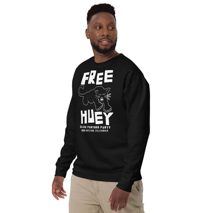 a man wearing a black sweatshirt with a free huey on it