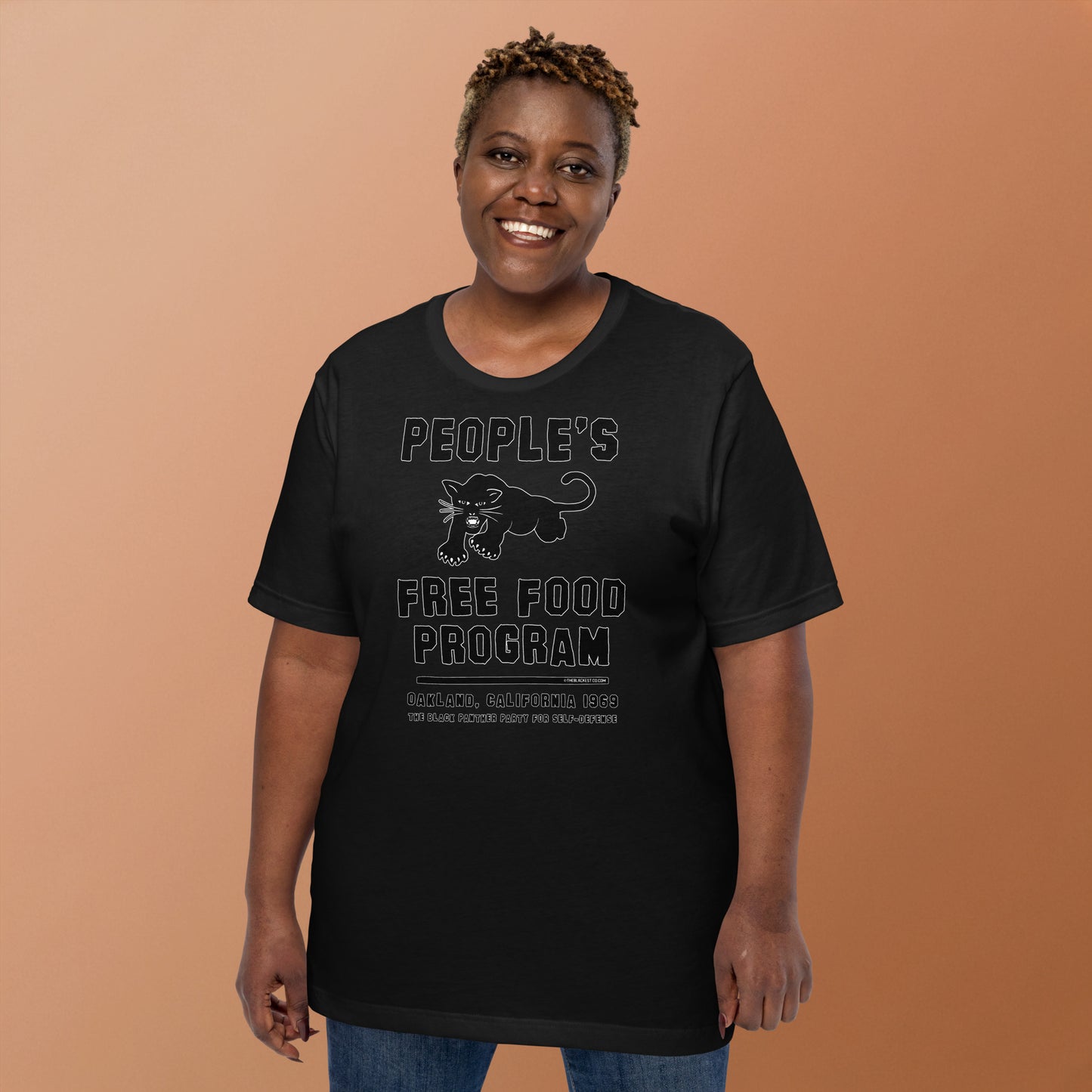 Black On Black BPP Free Food Program Fashion Unisex T-shirt worn by smiling woman, showcasing cultural empowerment design in relaxed fit.