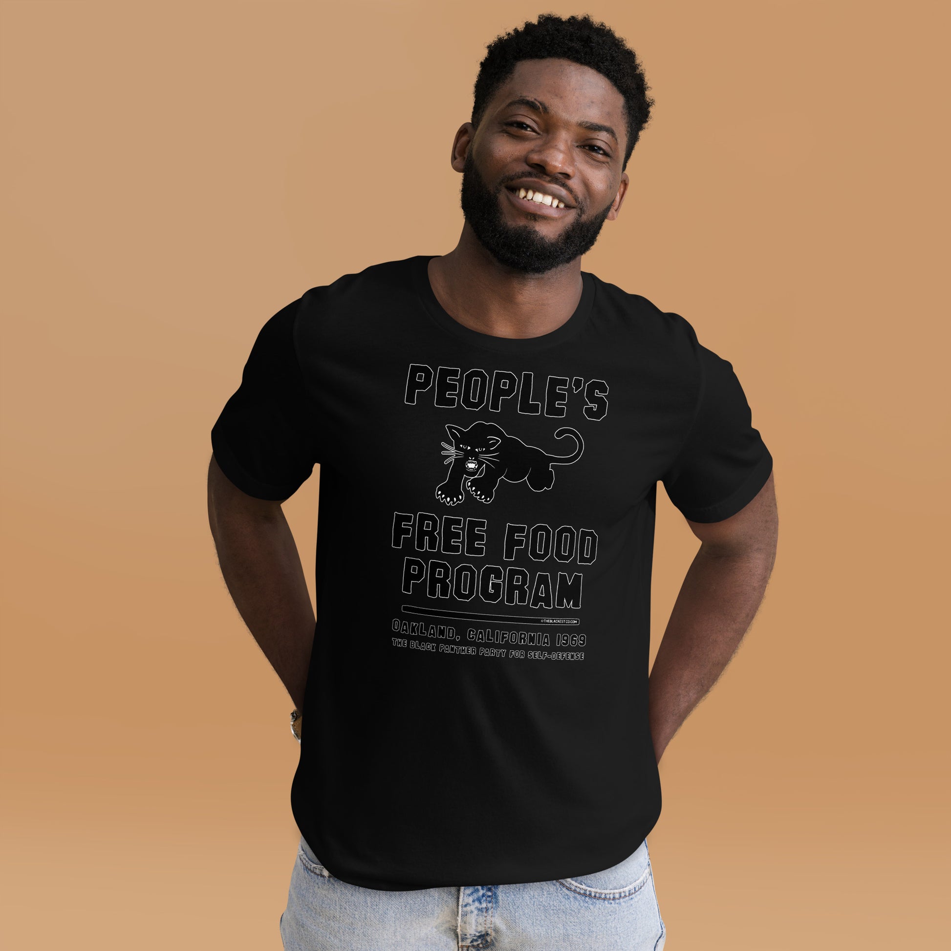 Black On Black BPP Free Food Program Fashion Unisex T-shirt worn by smiling man, emphasizing bold graphic and soft cotton fit.