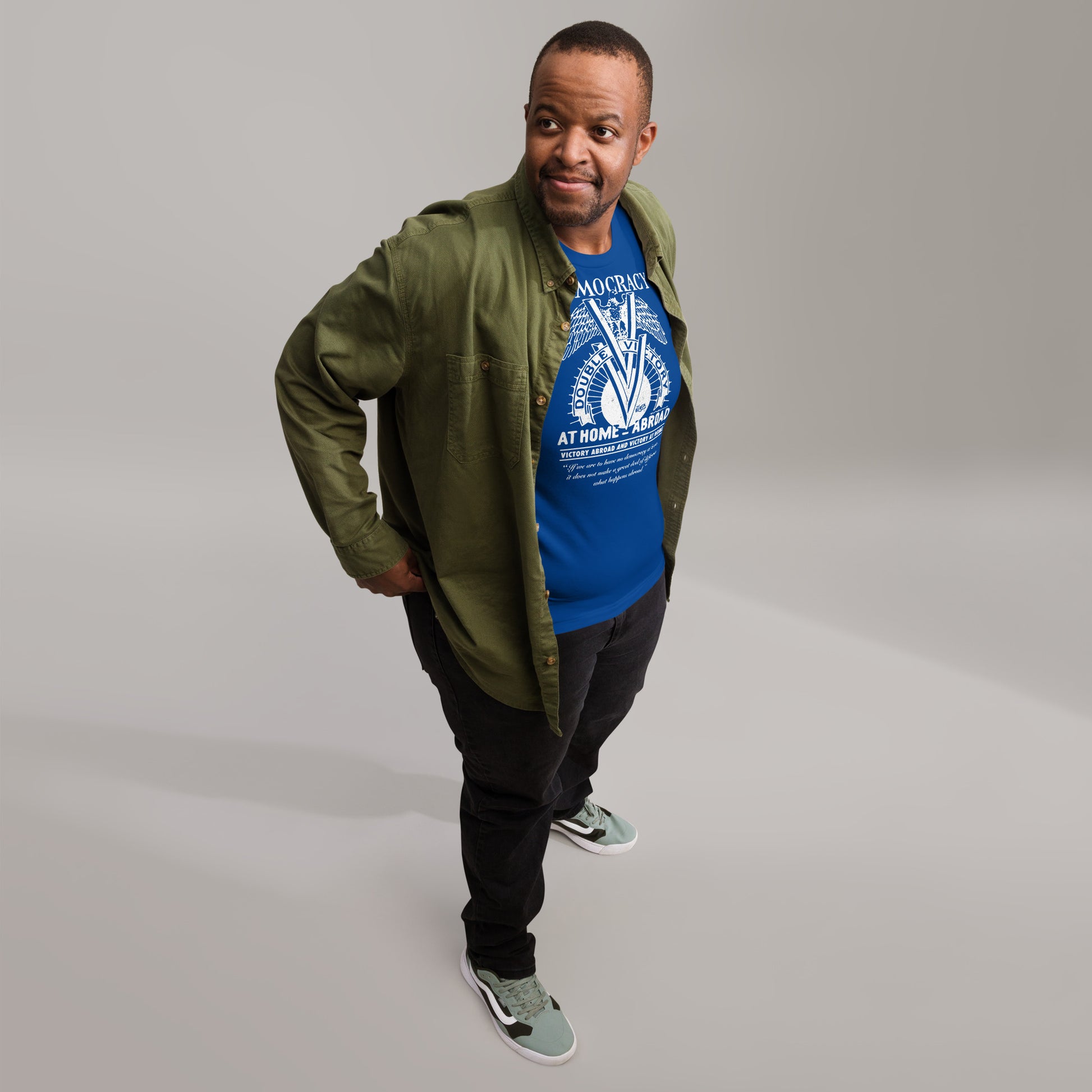 Man styled in layered outfit featuring royal blue Double V Campaign WWII Black Soldiers Fashion T-Shirt, perfect for casual fashion with history.