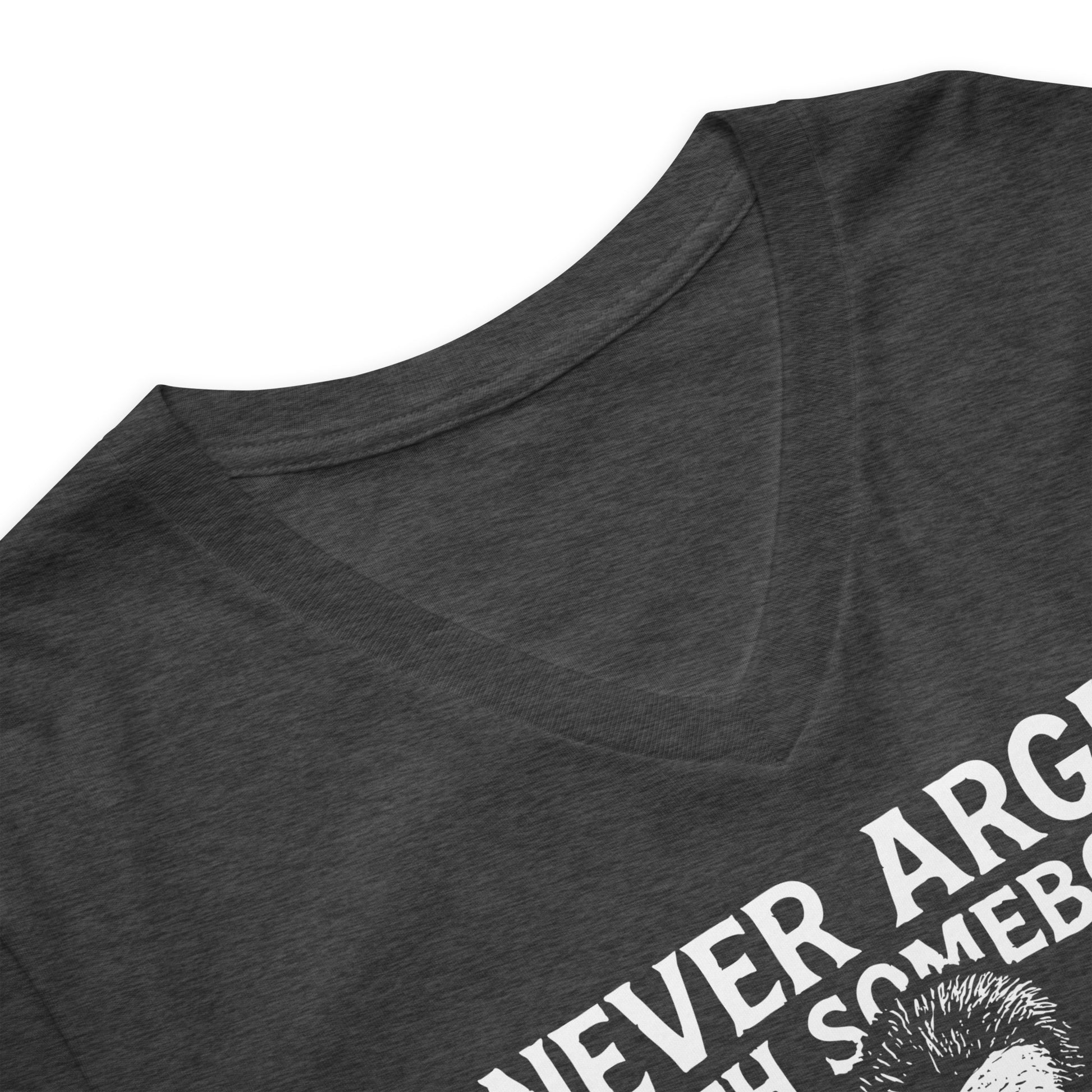 Close-up of Never Argue With Somebody John Brown Unisex V-Neck T-Shirt neckline showing soft fabric and detailed print quality in dark heather gray.