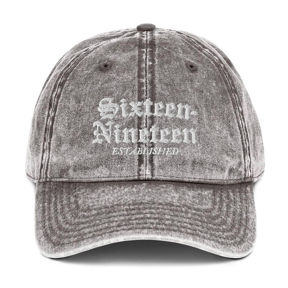a gray hat with white lettering on it