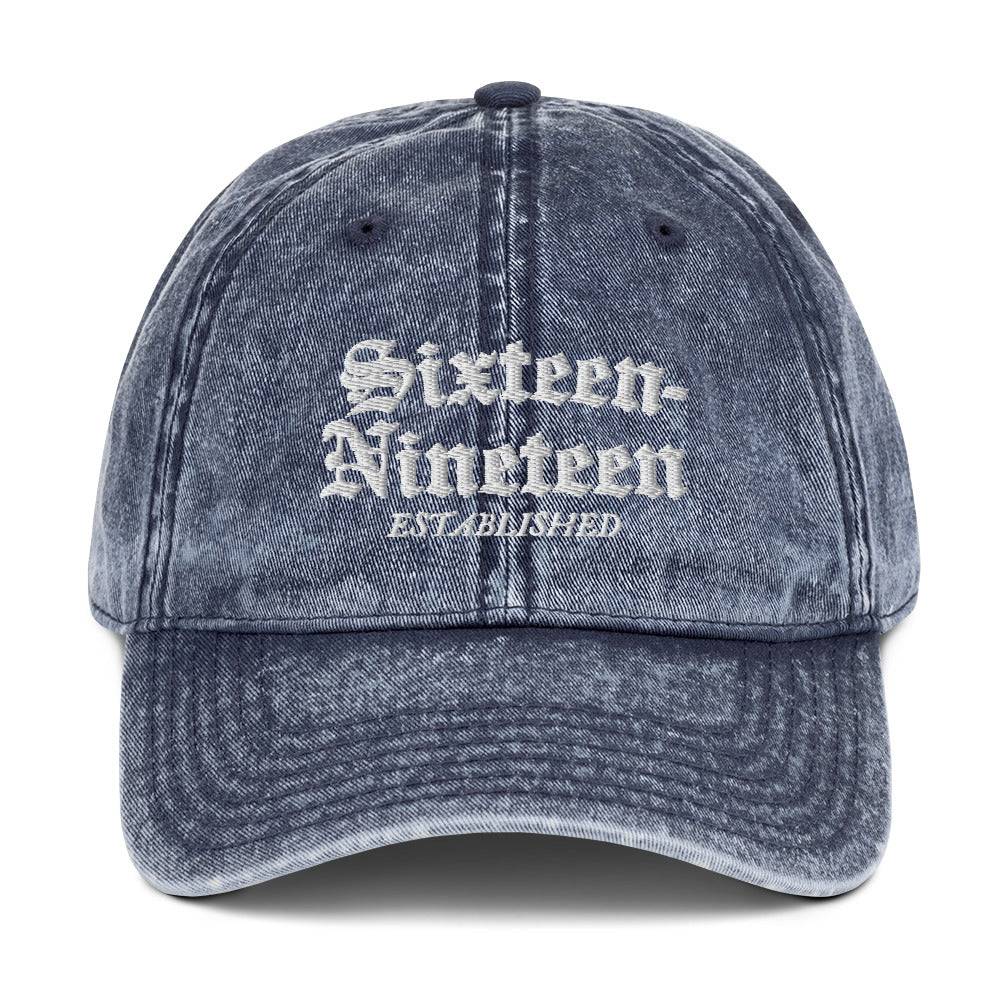 a blue hat with the words sixteen thirteen written on it