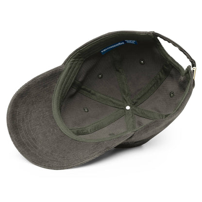 a grey hat with a blue patch on the side