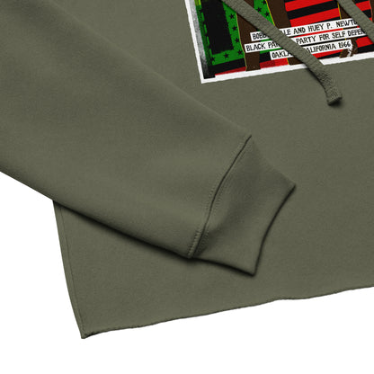 Close-up of The Black Panther Party BPP Storefront Crop Hoodie sleeve and hem, showing soft fabric texture and detailed BPP graphic print.