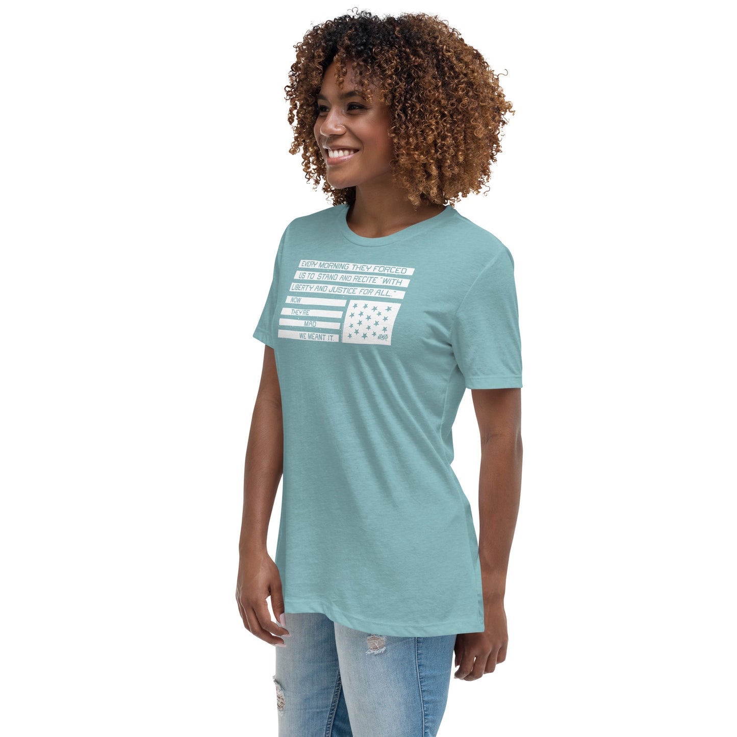 Light blue women's t-shirt with protest quote and star-spangled flag graphic, casual apparel for activism, printed in USA.