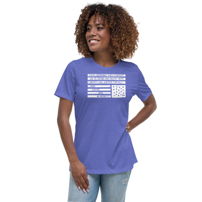 Woman wearing a blue relaxed fit protest t-shirt with quote and flag design, casual social justice apparel, model smiling