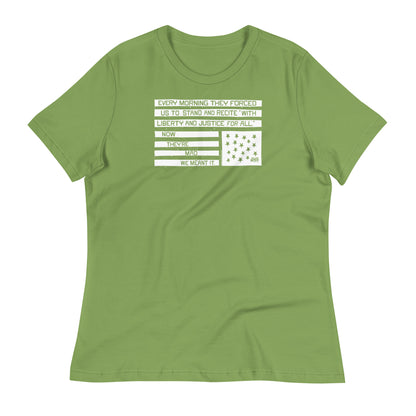 Green relaxed women's t-shirt with protest quote and star graphic, casual social justice apparel, model smiling