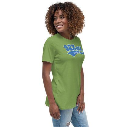 Woman wearing a green '92 Percenter Integrity Matters' relaxed t-shirt styled with light blue jeans, bold and comfortable.