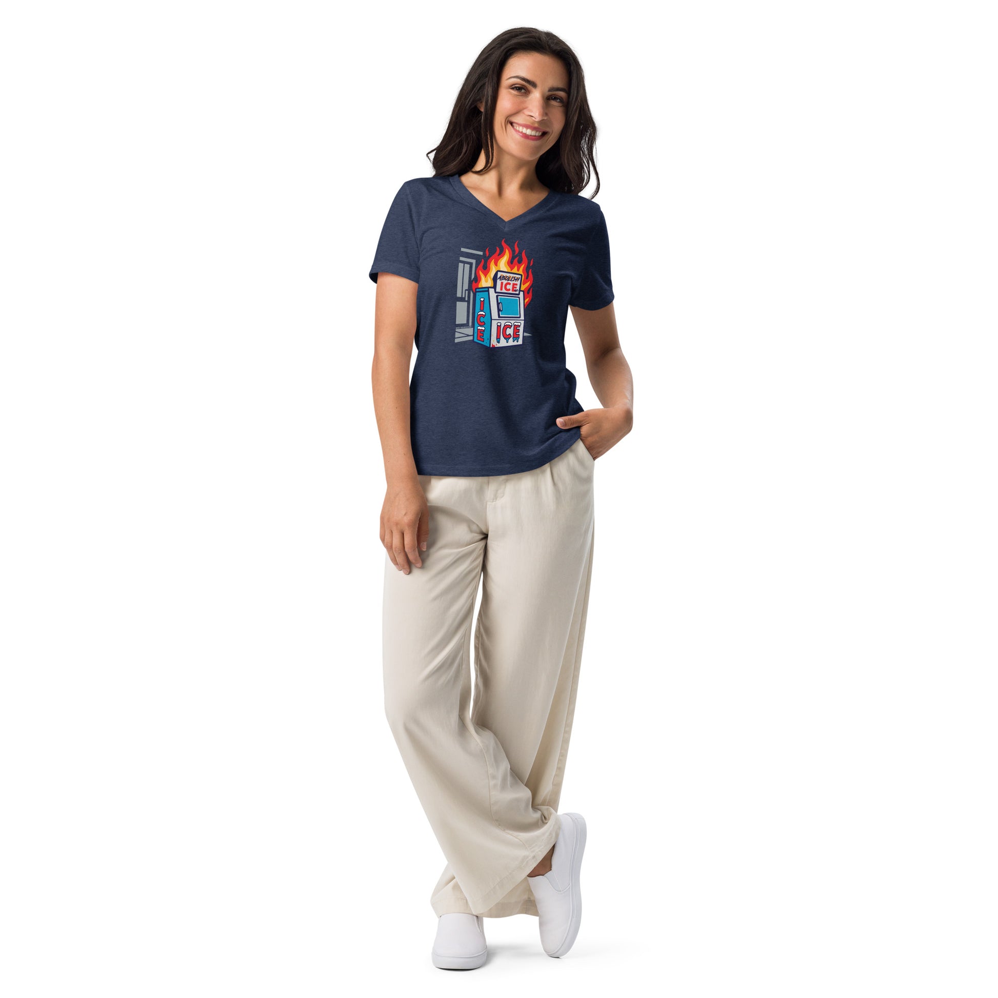 Model wearing Abolish ICE Women’s V-neck T-Shirt in navy, styled with cream pants, showcasing activist streetwear from TheBlackest Co.
