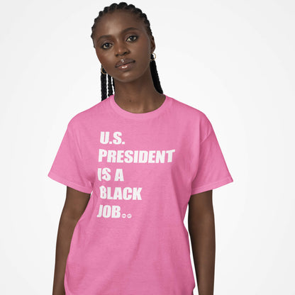 Woman wearing pink 'U.S. President Is A Black Job' t-shirt