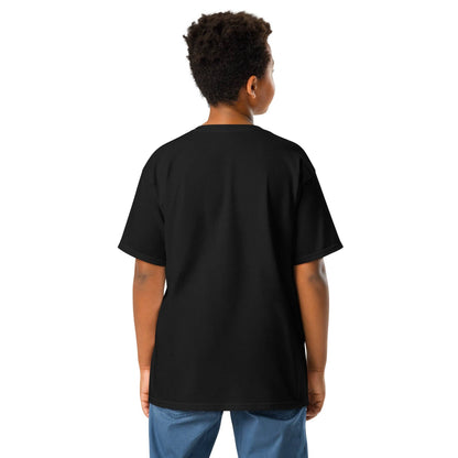 a young boy wearing a black t - shirt