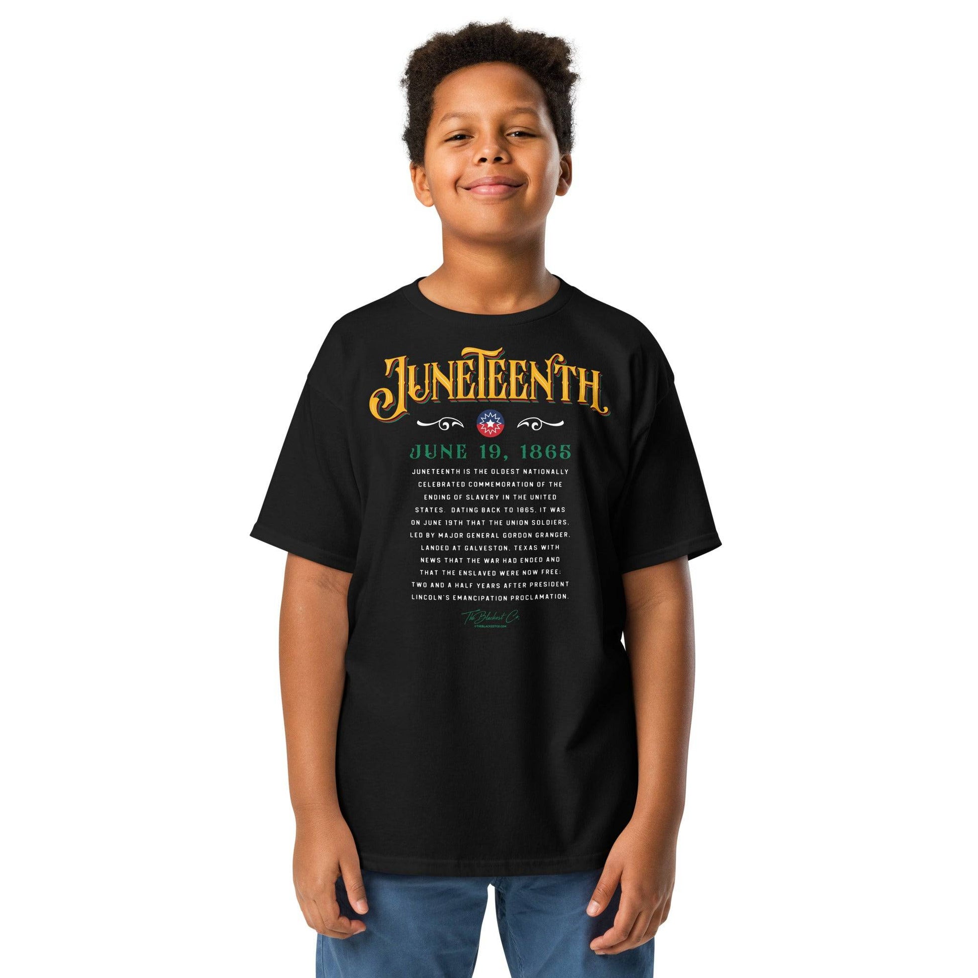 a young boy wearing a black t - shirt with the words juneteenth