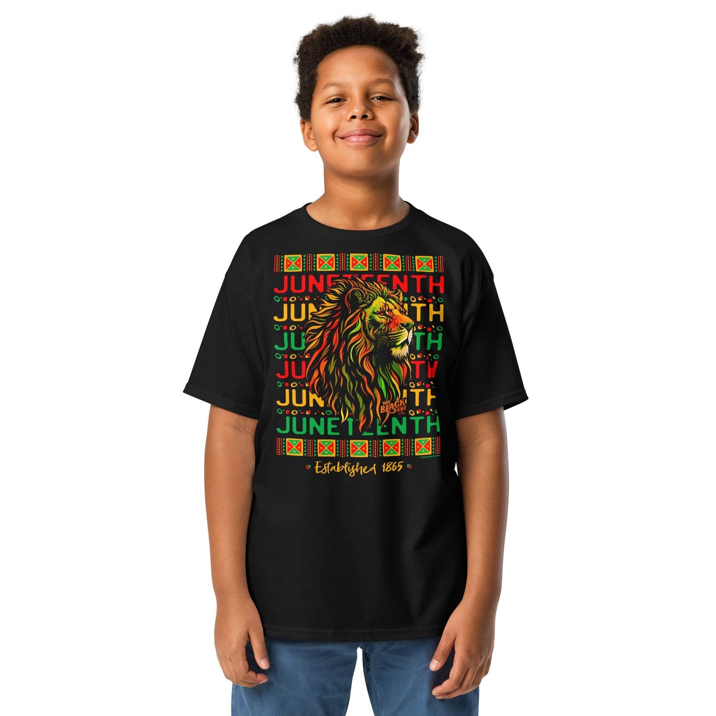 a young boy wearing a black t - shirt with juneteenth and a lion on it