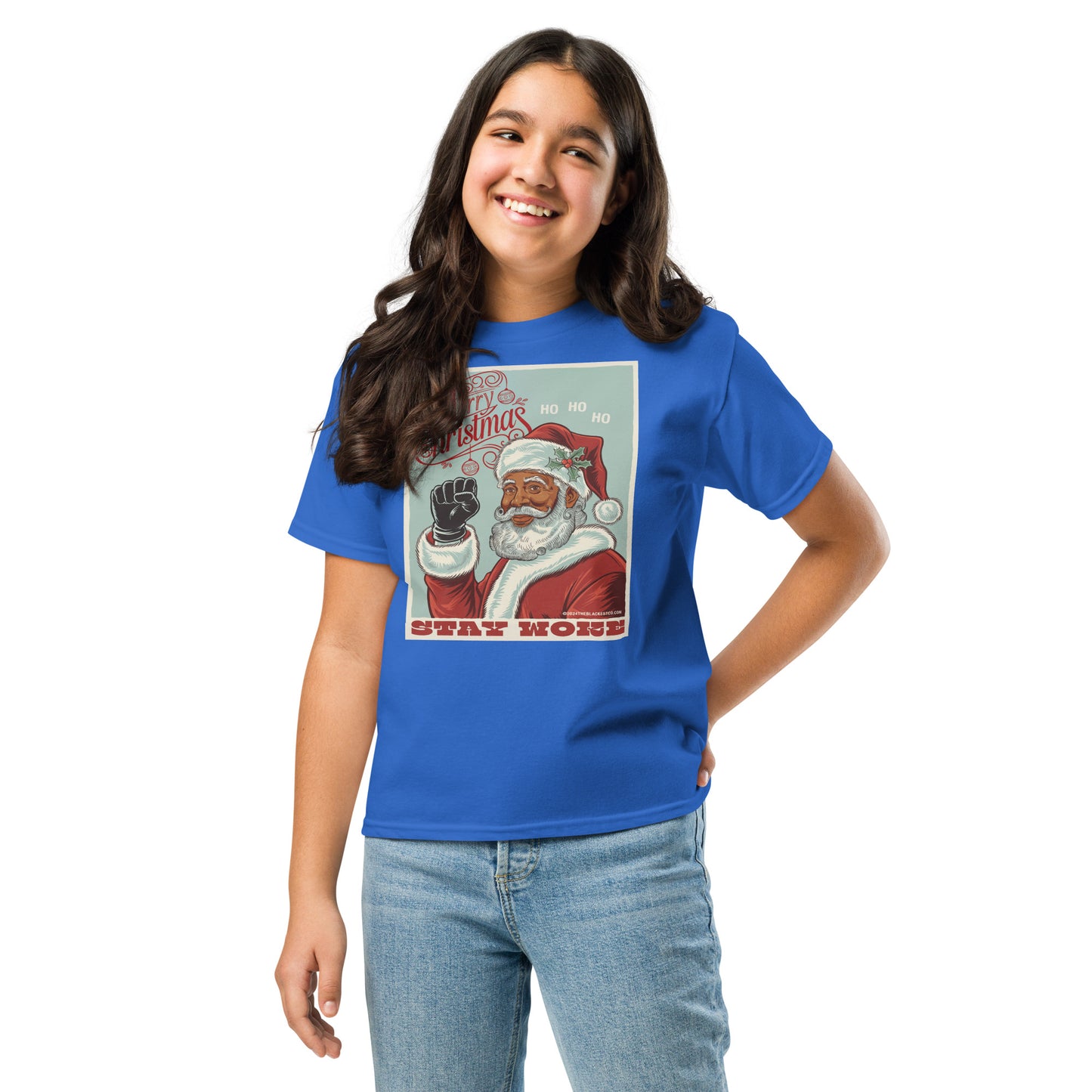 Girl wearing a bright blue youth Christmas graphic T-shirt featuring Santa Claus with the phrase 'Stay Woke' and holiday design, casual denim jeans