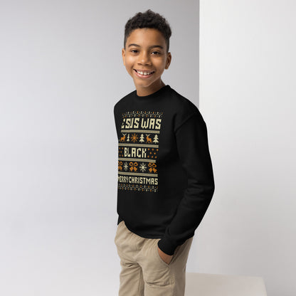 Boy modeling black Youth Jesus Was Black Merry Christmas crewneck sweatshirt, showcasing festive and empowering holiday kids clothing.